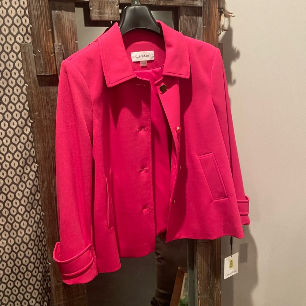 Calvin Klein pink suit.  Pants and jacket Gold zippers and buttons.